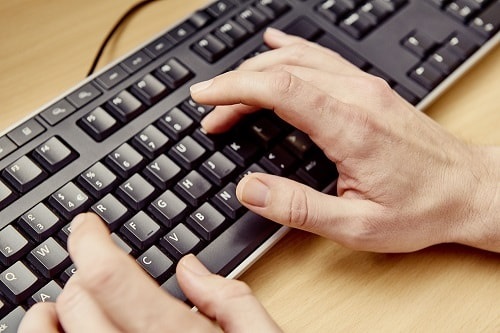 typing on computer keyboard